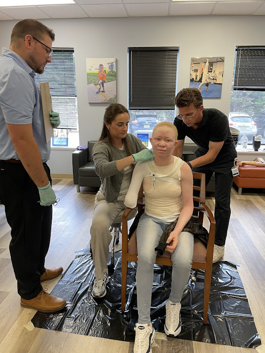 O&P students fitting patient with prosthetic
