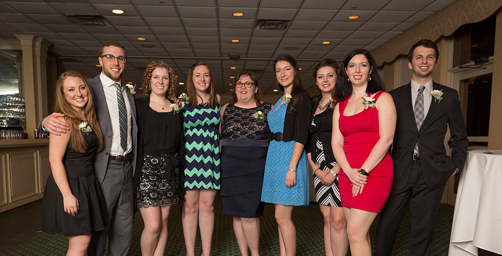 alums posing for a photo