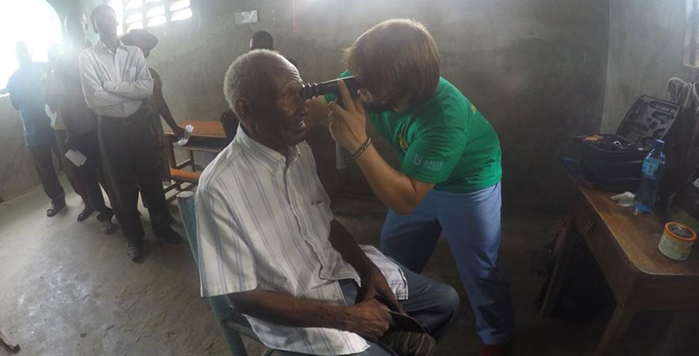 student conducting eye exam