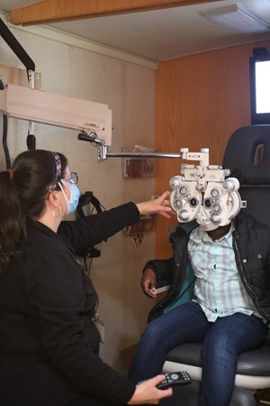 Dr. Scombordi-Raghu providing eye exam to student