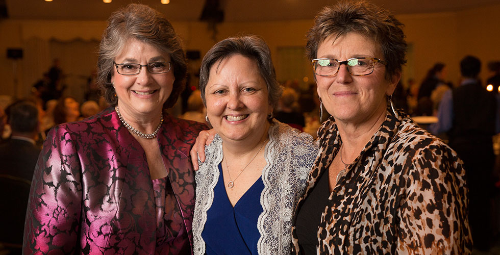 alums posing for a photo