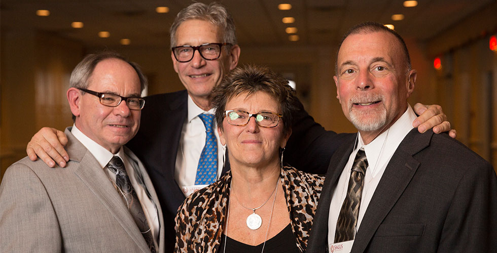 alums posing for a photo