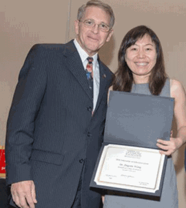 Jingyun Wang, PhD receiving award