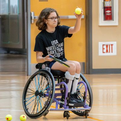 Girl playing wheelchair tennis thumbpic