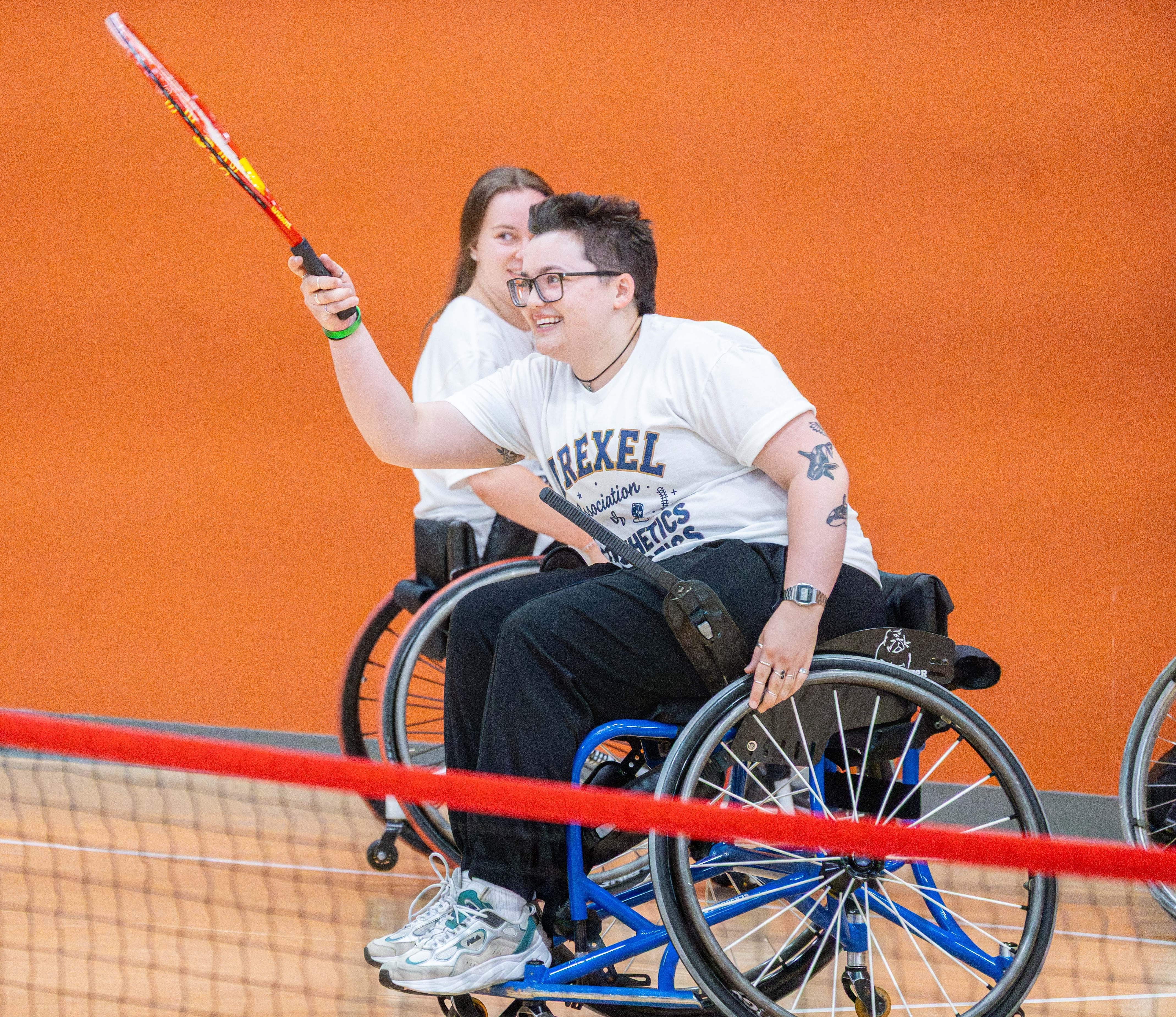 Woman playing wheelchair tennis
