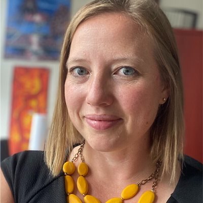 headshot of Anna Grasso smiling at the camera