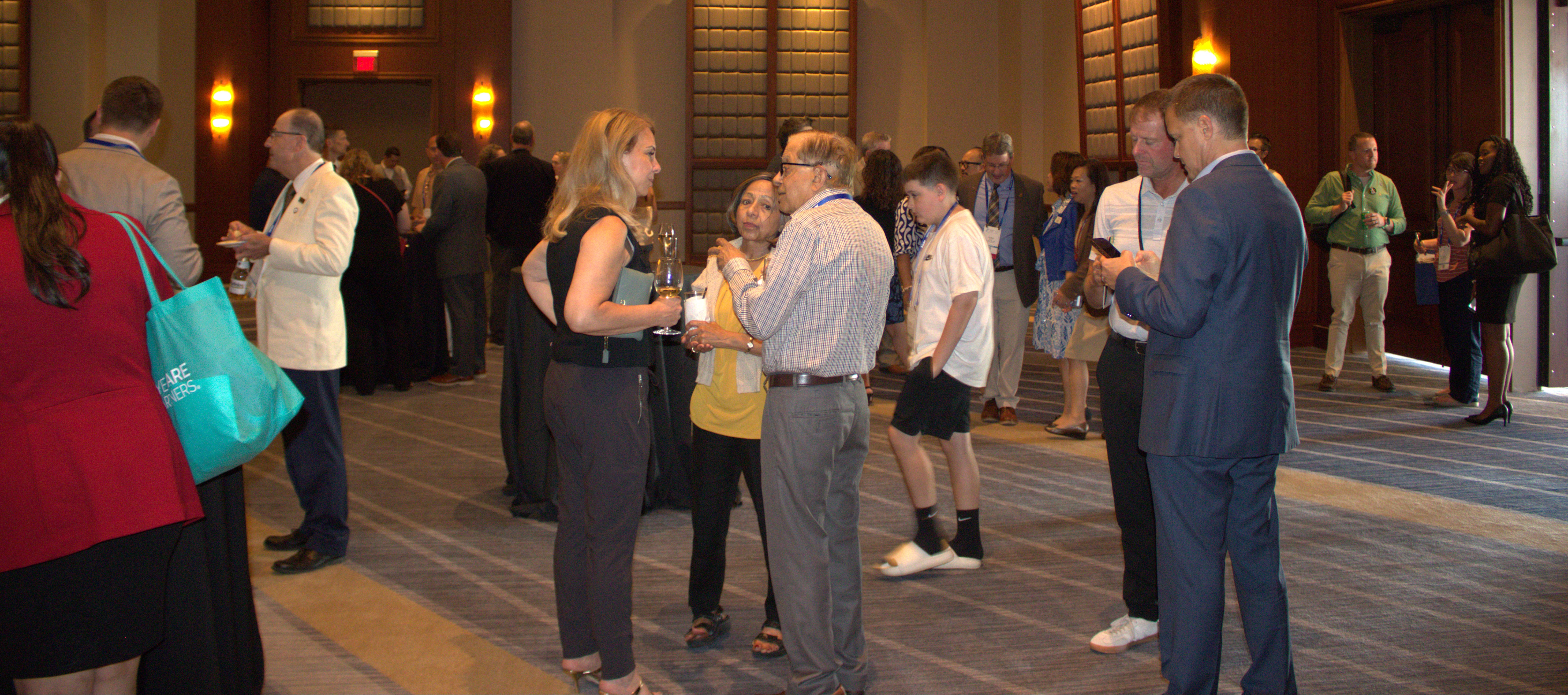 PCO alumni mingle at alumni reception