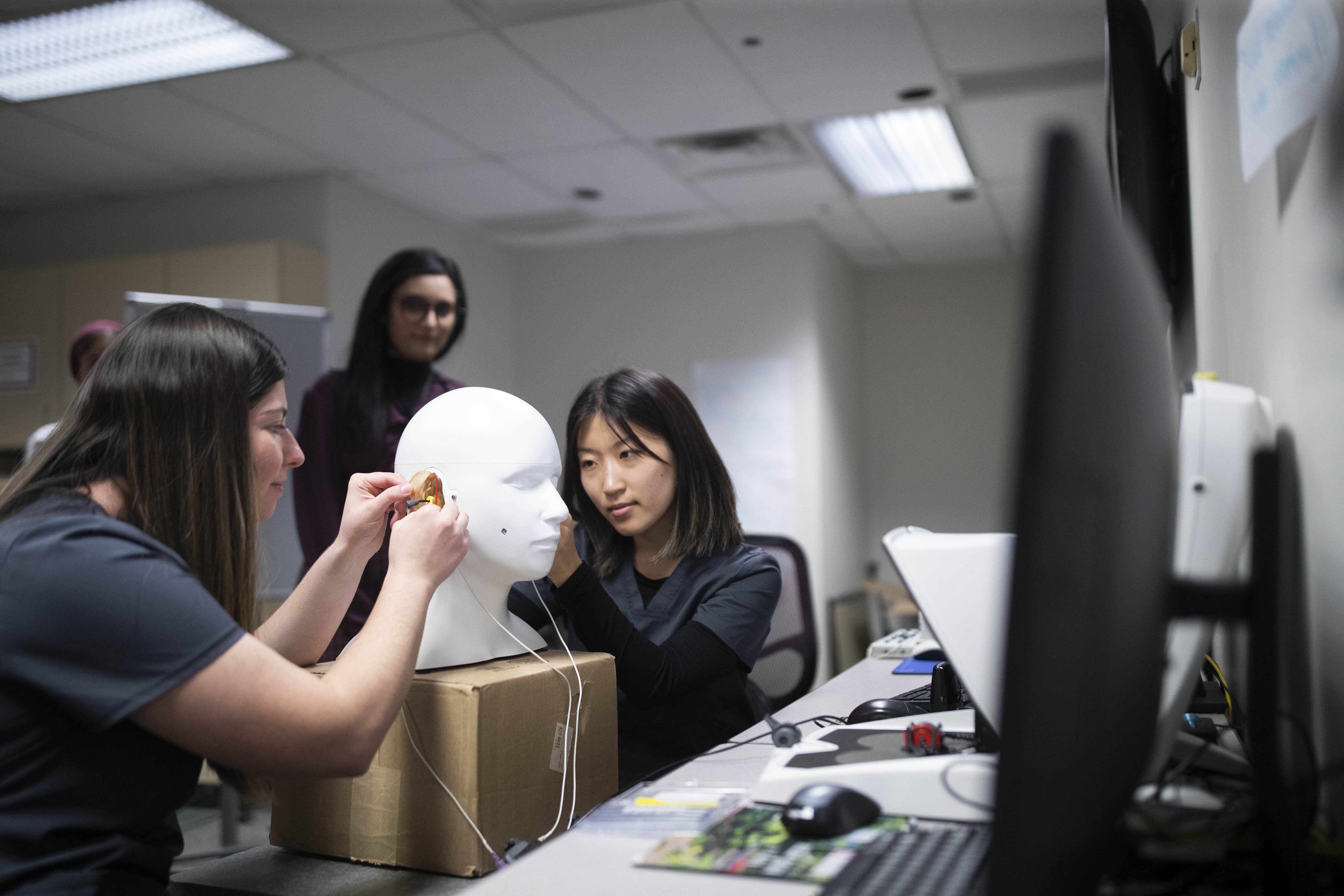 Two AUD students in the hearing lab
