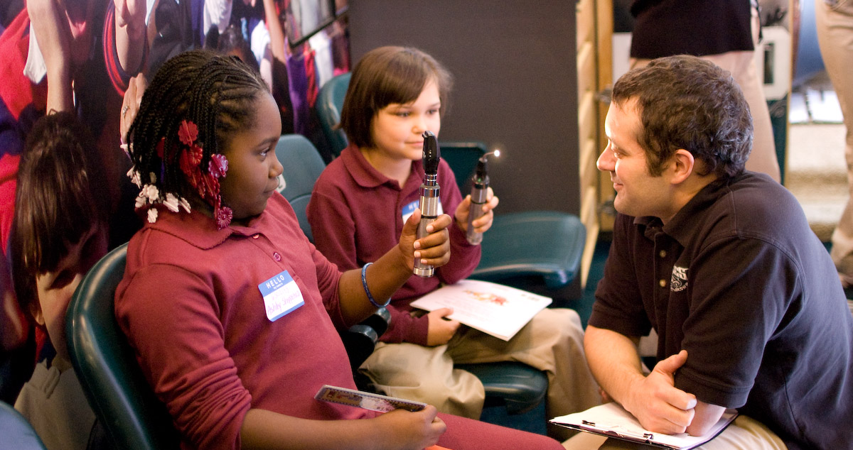 Dr. Carter Liotta working with pediatric patients