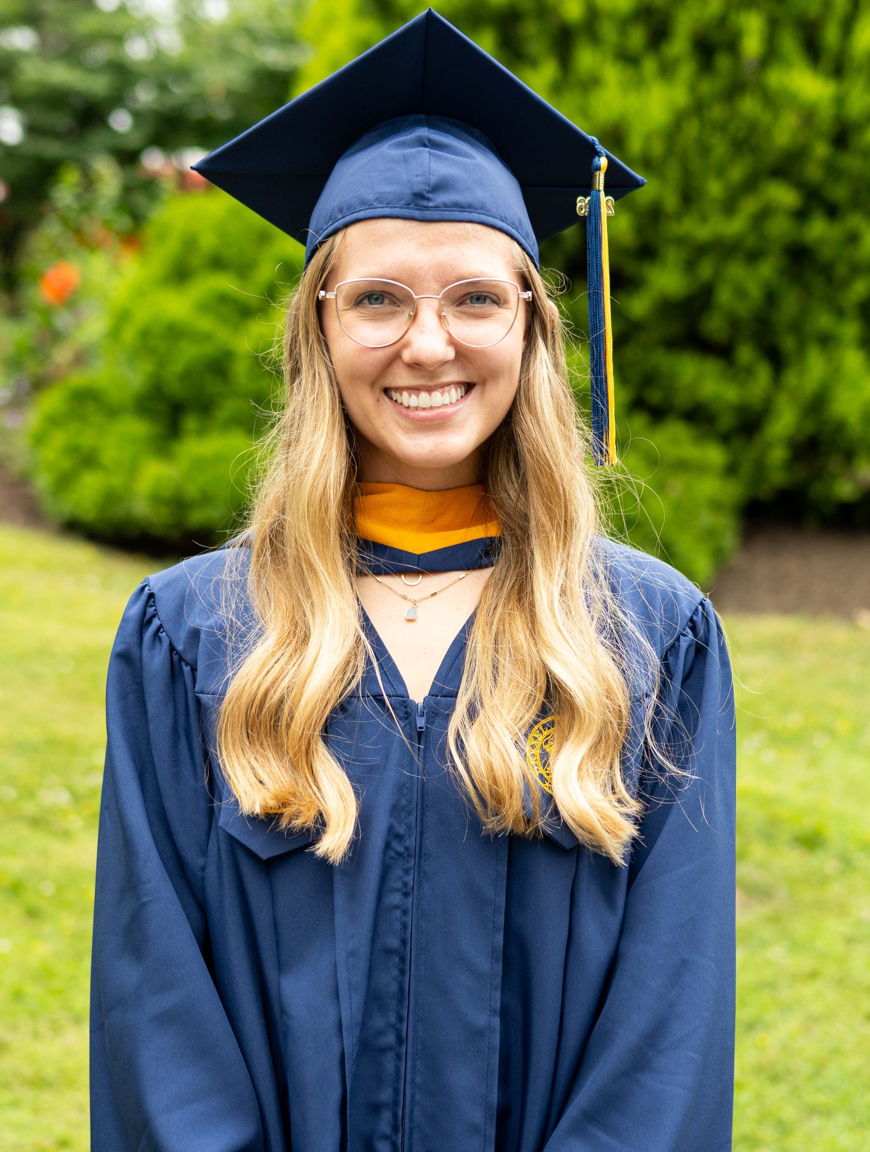 Grad Regan Thompson in cap and gown