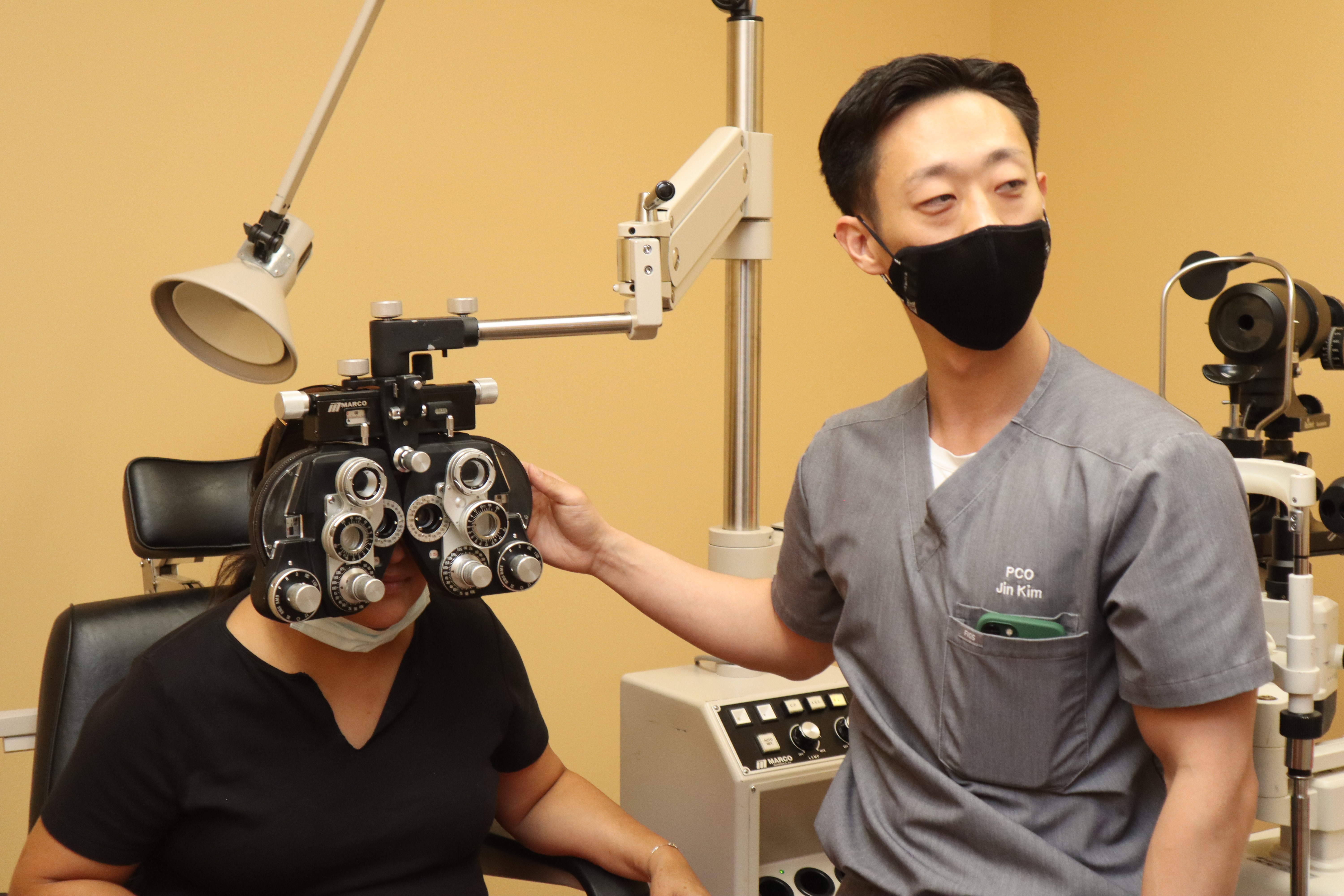 PCO doc performs eye exam on patient