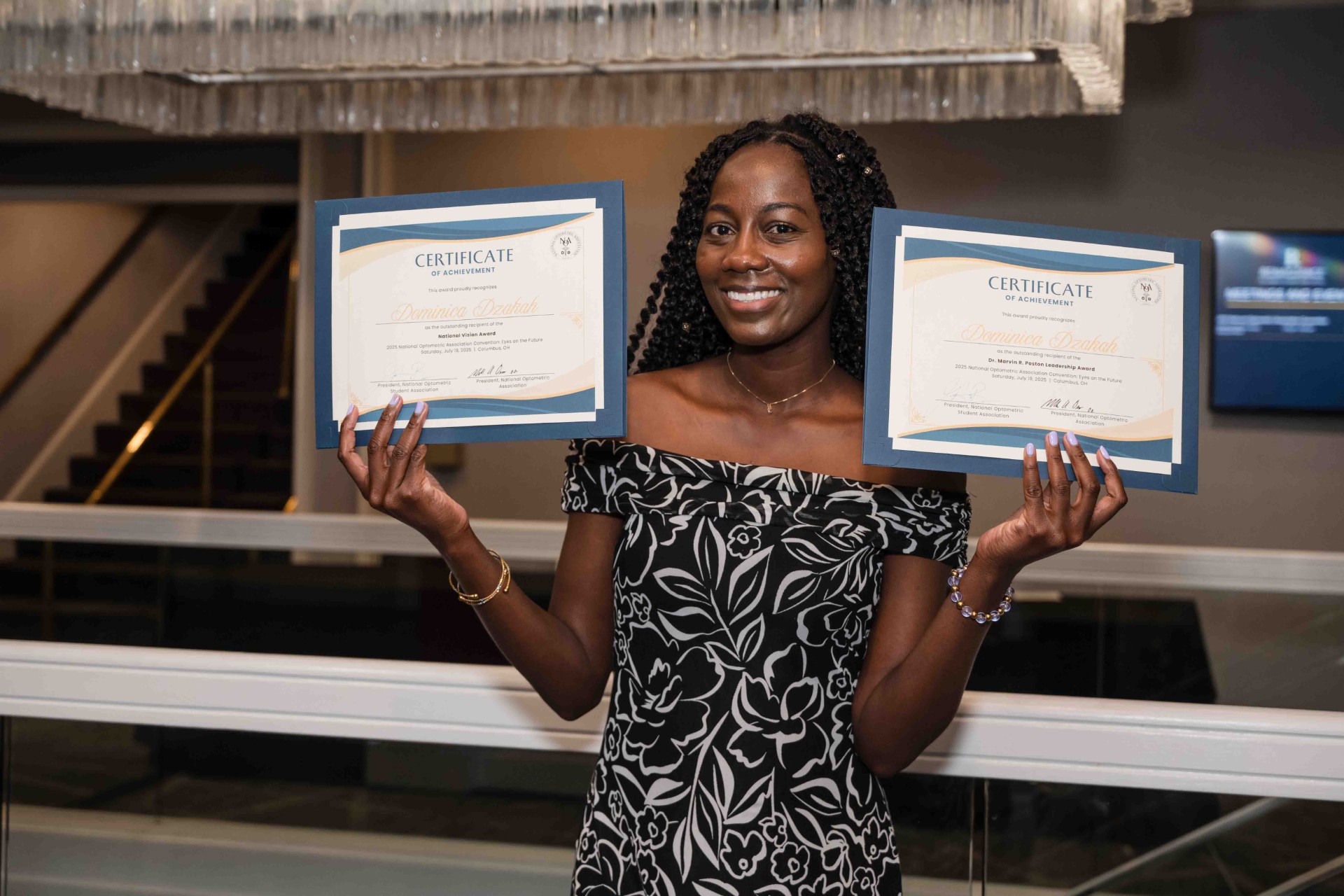 Dominica with her two certificates