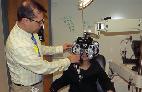 Luis Trujillo examining patient