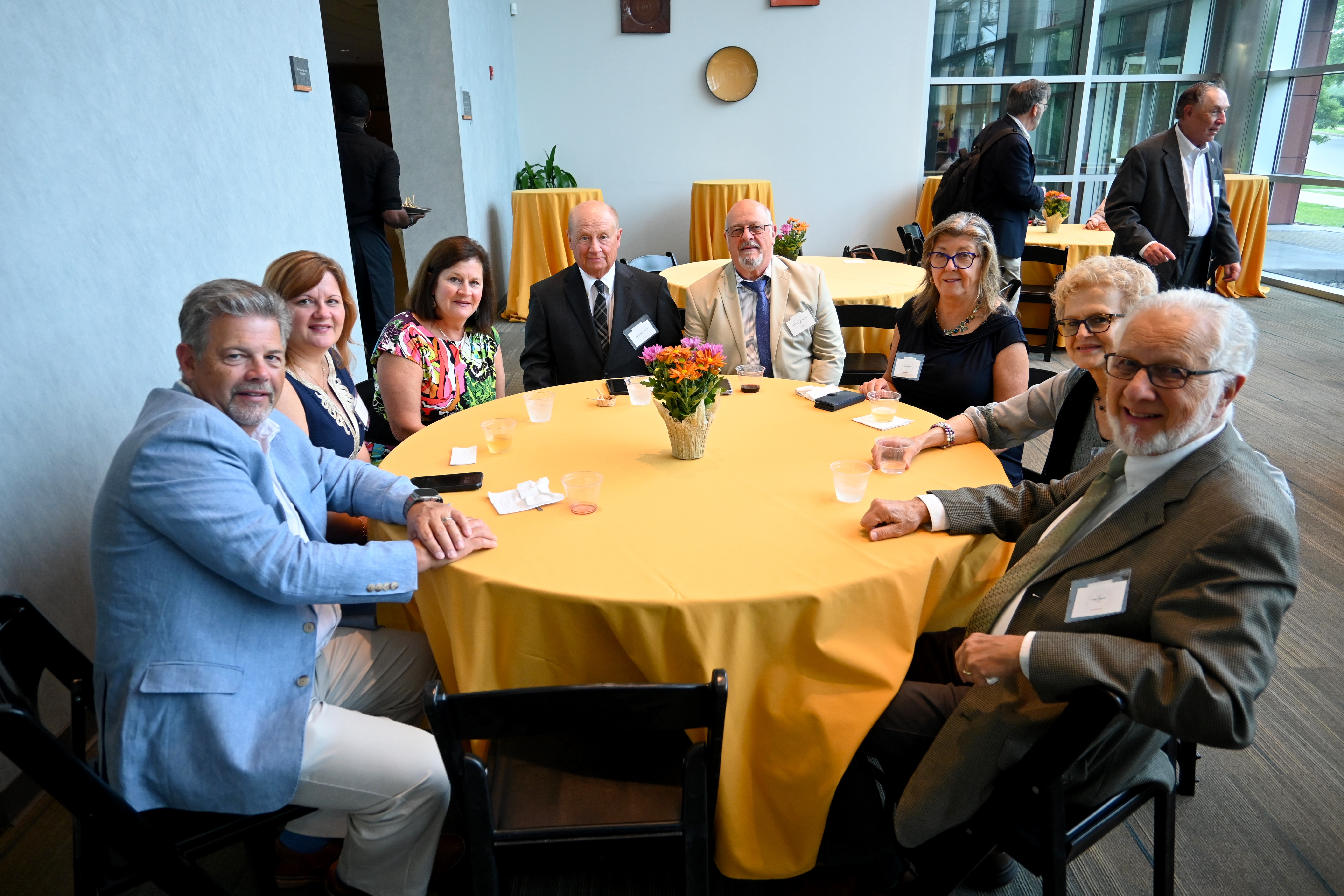 Alumni group sitting around a table