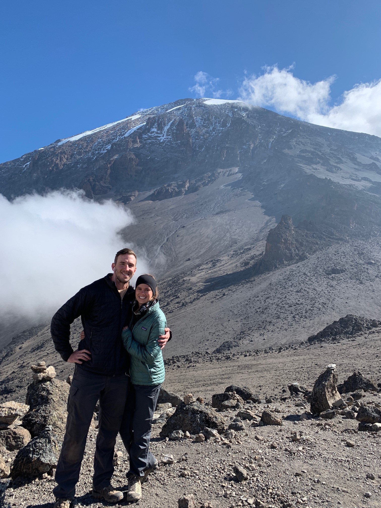 Emily Jolotta and husband on top of mountain