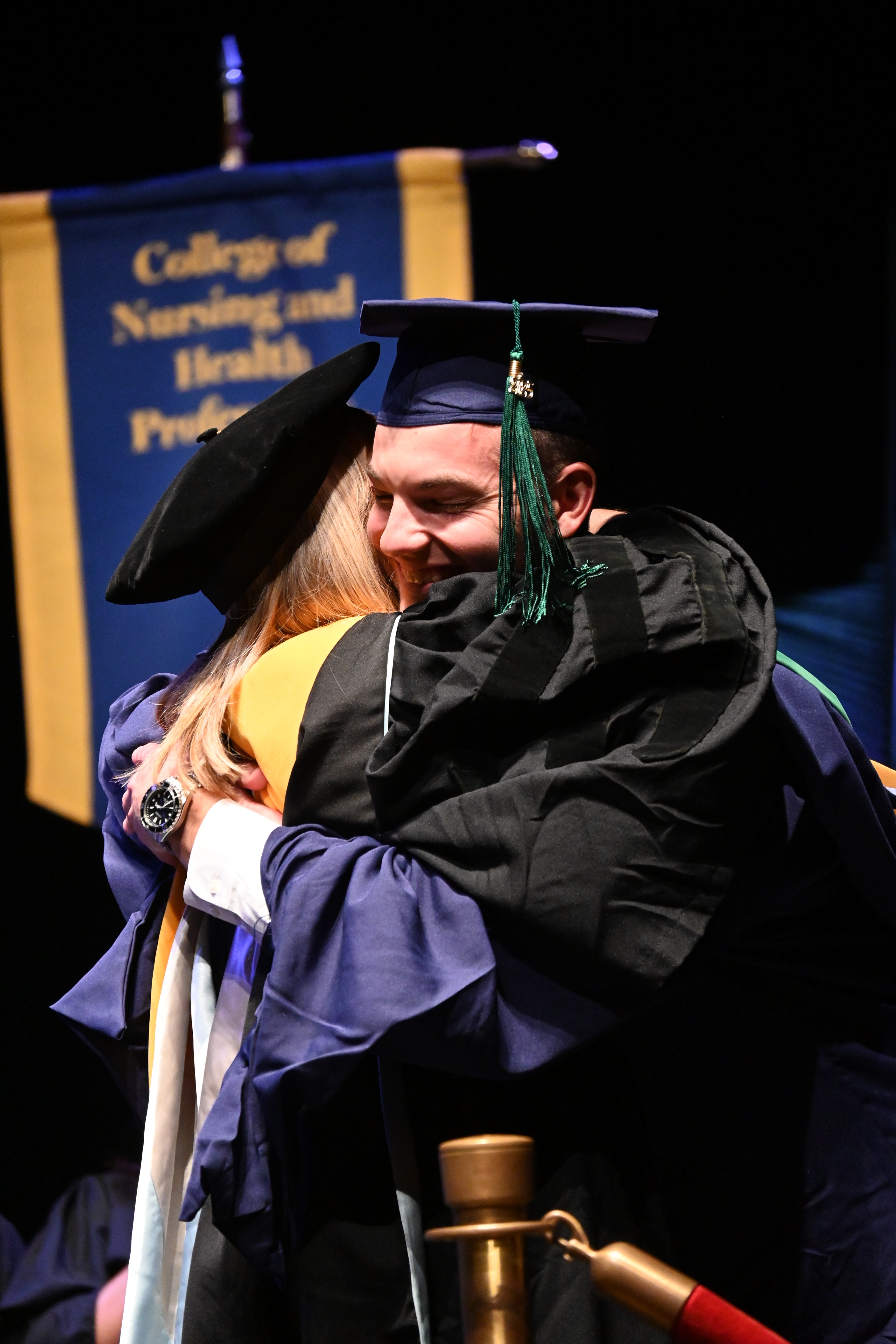 Graduate hugs professor pic6