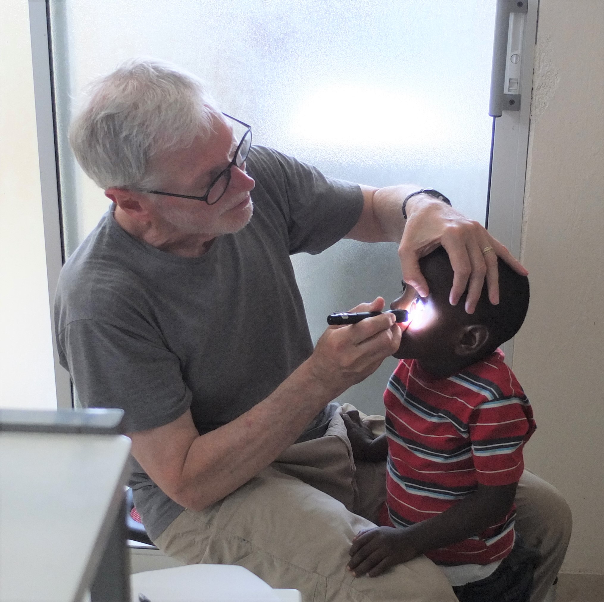 Henry Greene treating a child patient