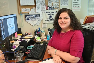 Jamie Schulang sitting at her work desk