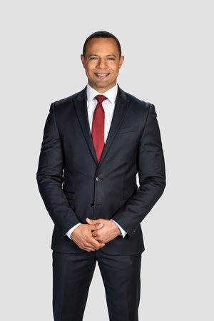 Johnny Archer headshot in a suit and red tie