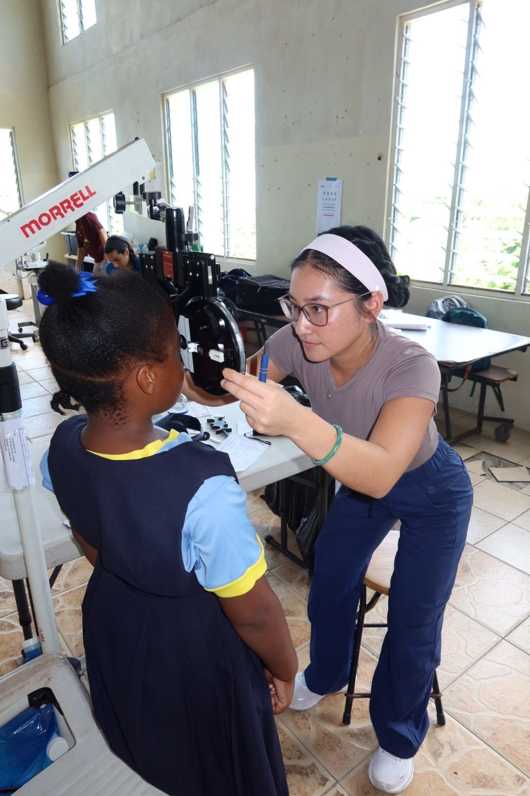 SOSH Kirsten Tran examining patient pic3