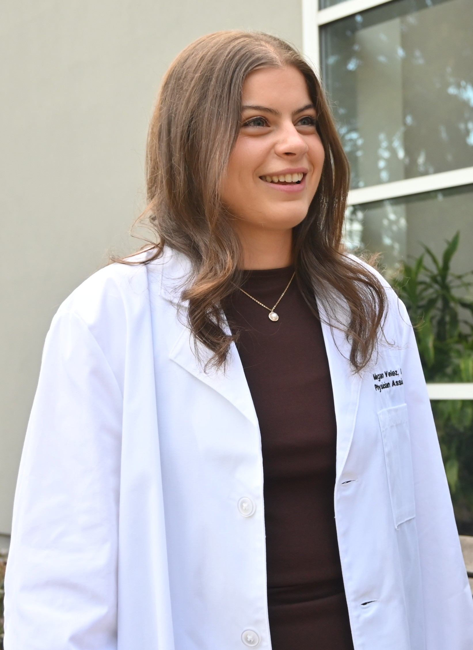 Megan Velez in white coat pic1