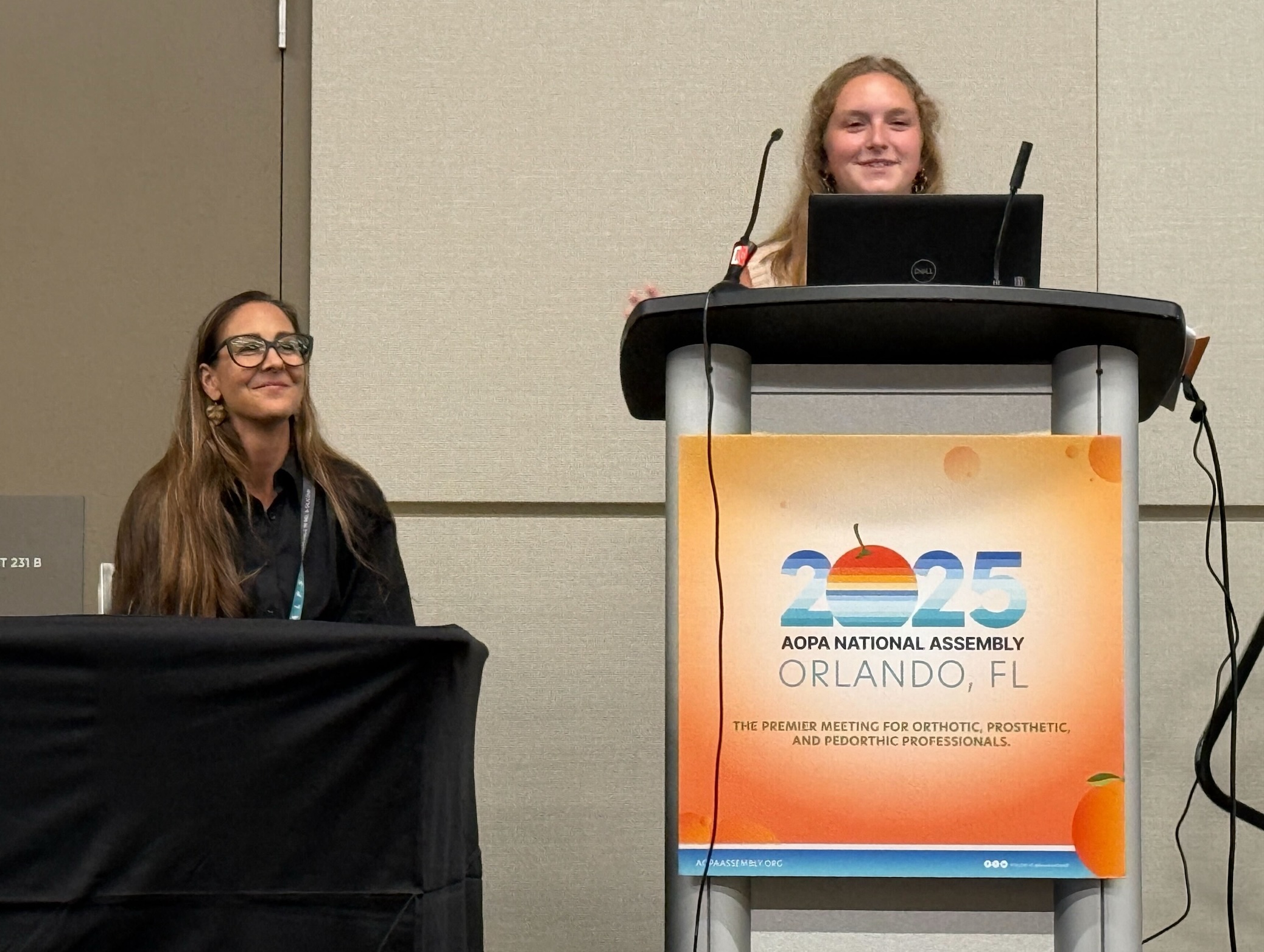Mary-Kate Dennis at the conference podium pic3