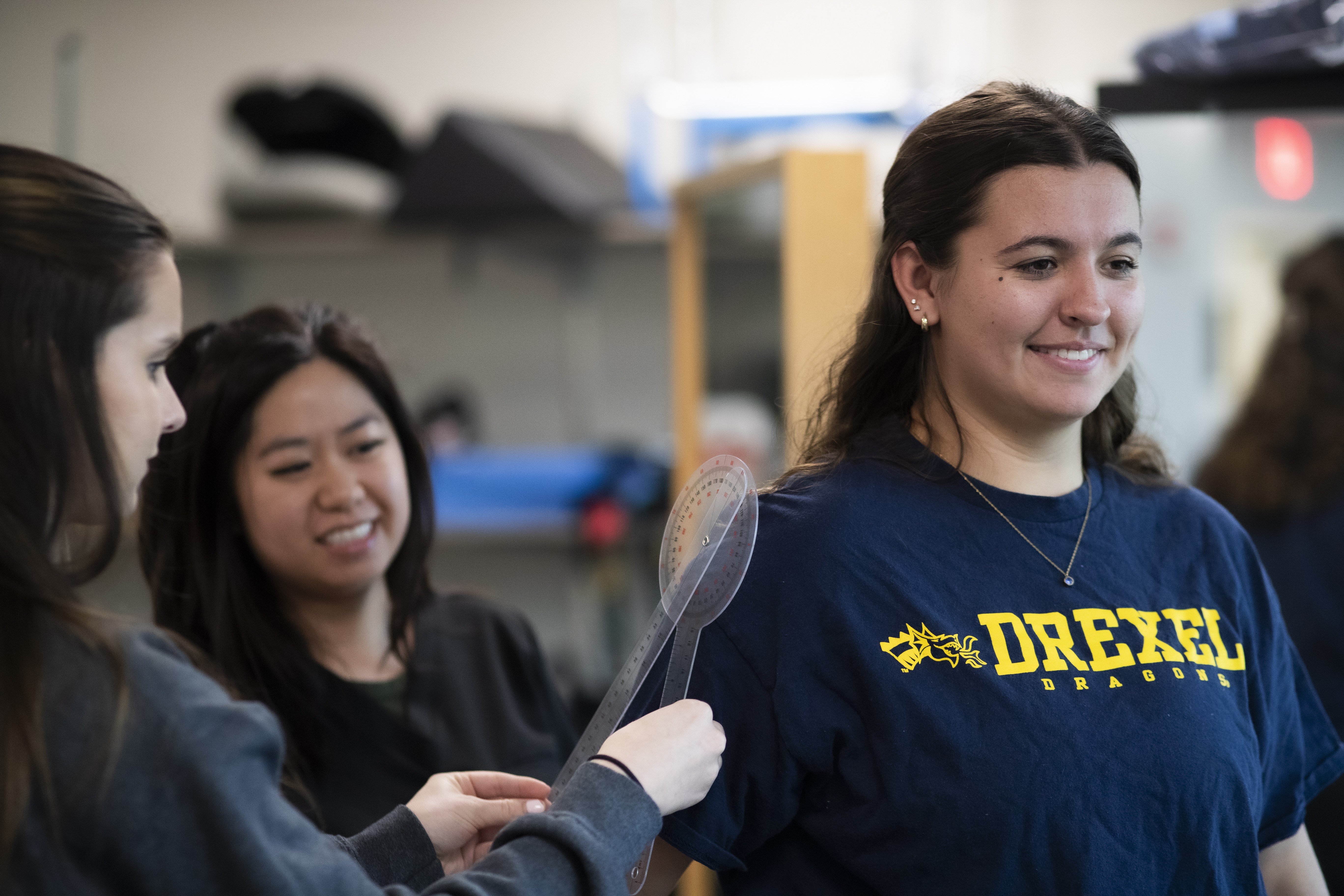 Patient with two OT students in the lab pic2