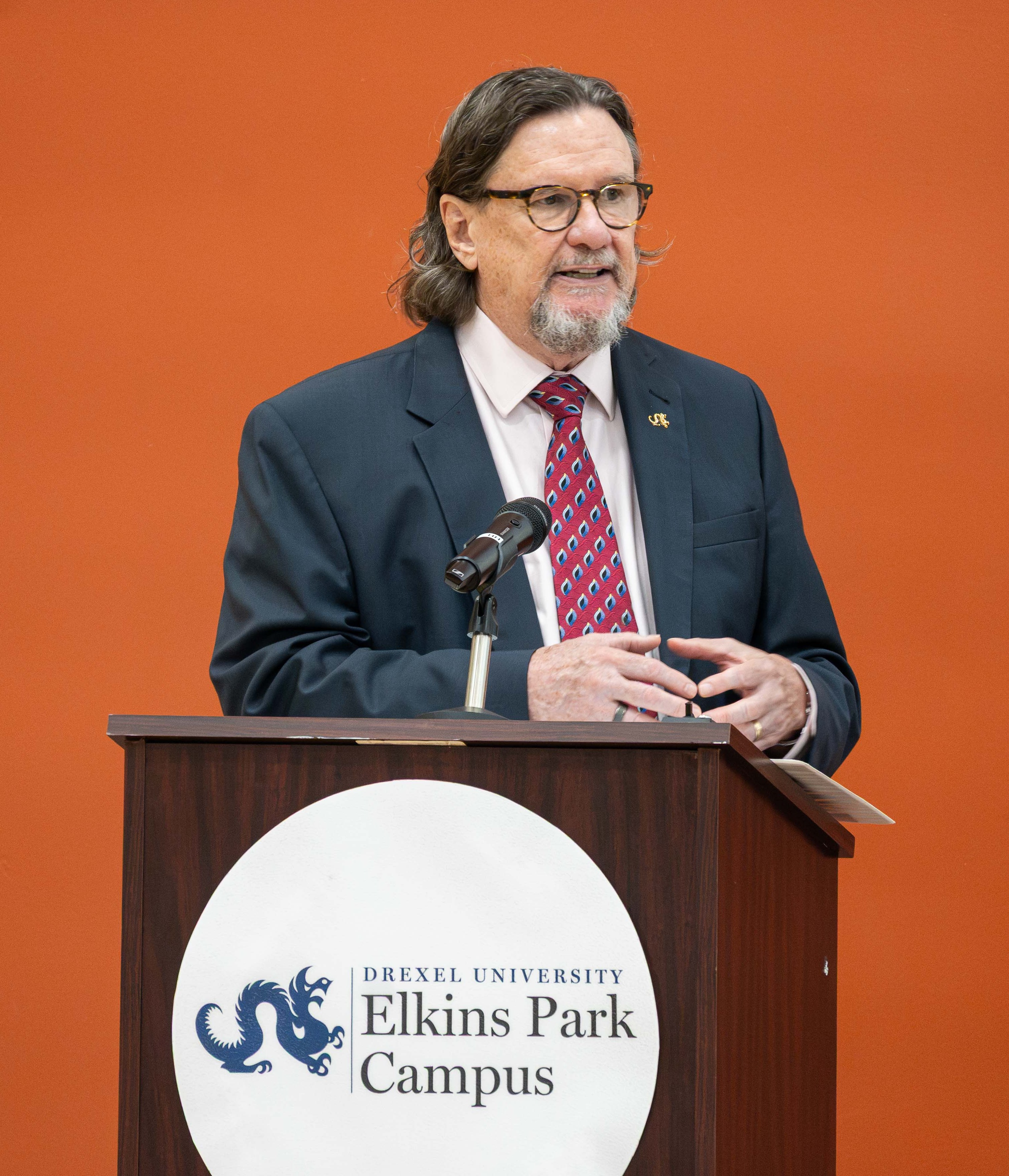 AUD faculty Dr. Victor Bray at the podium