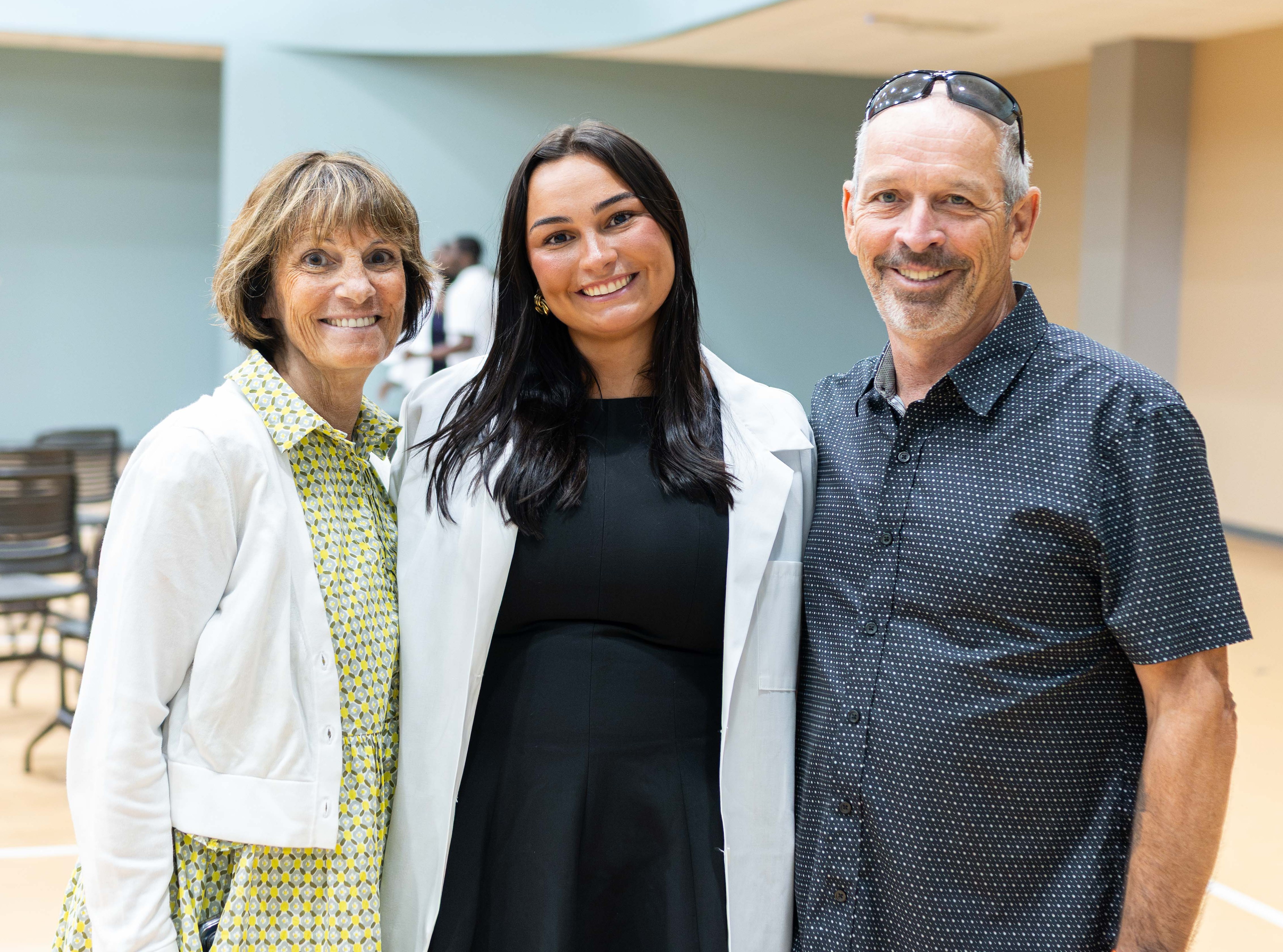 PA student Melanie Simpson and her parents at white coat