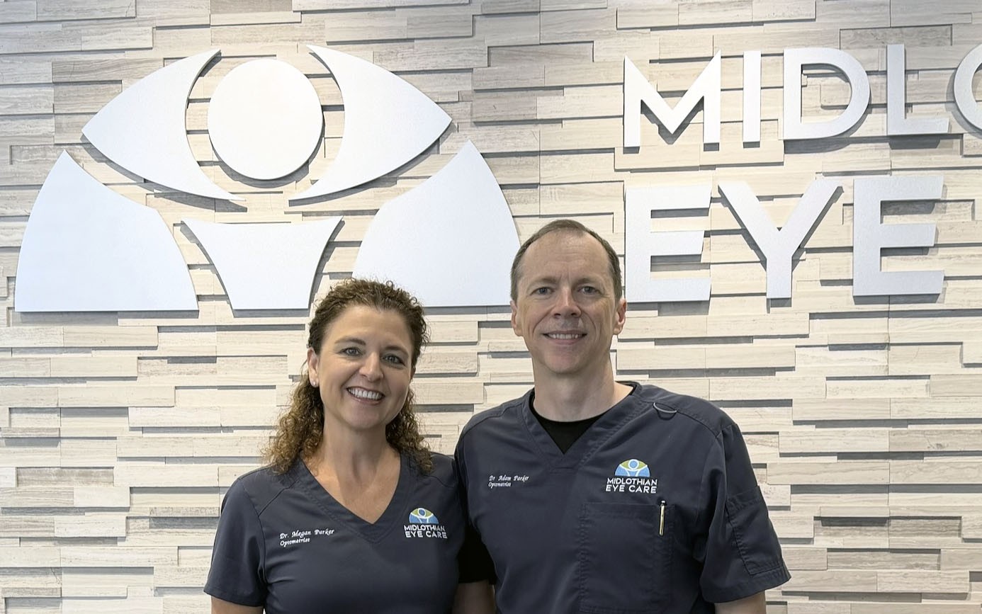 Drs. Adam and Megan Parker in front of their clinic