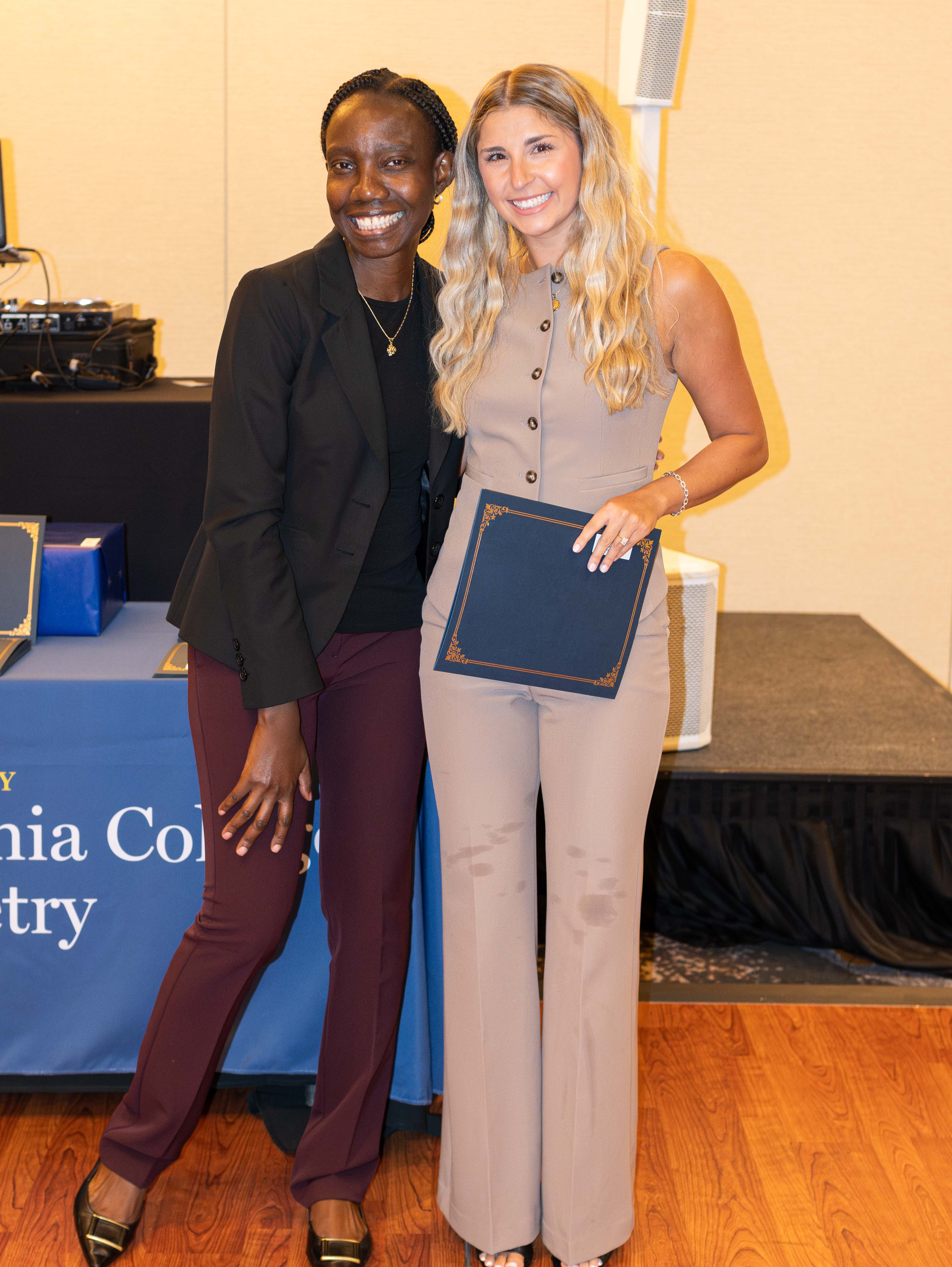 Dr. Ibironke with PCO grad award winner