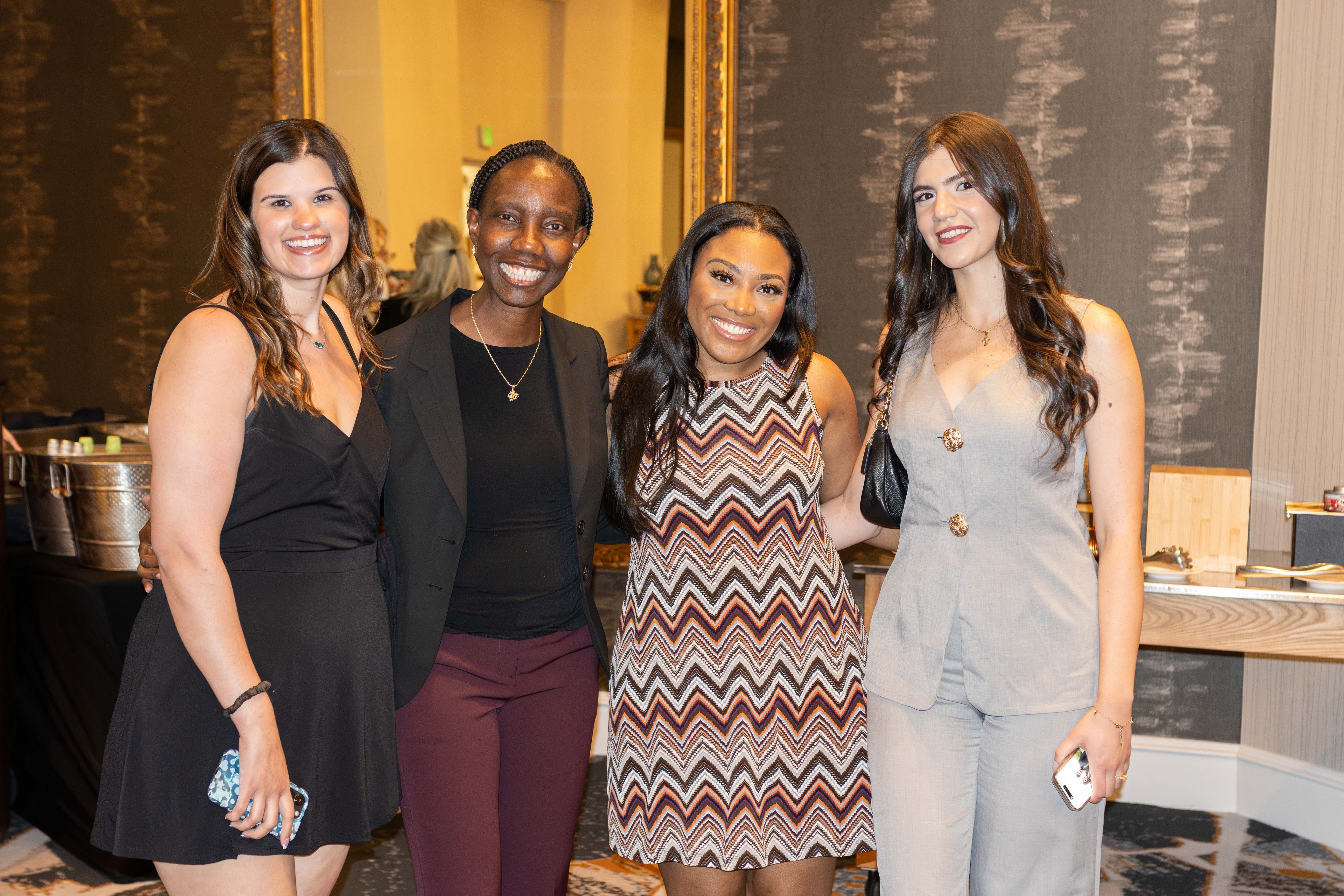 Female PCO grads at commencement recpetion