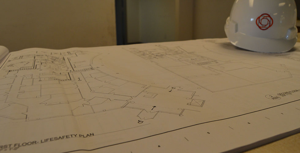 blueprints and hard hat