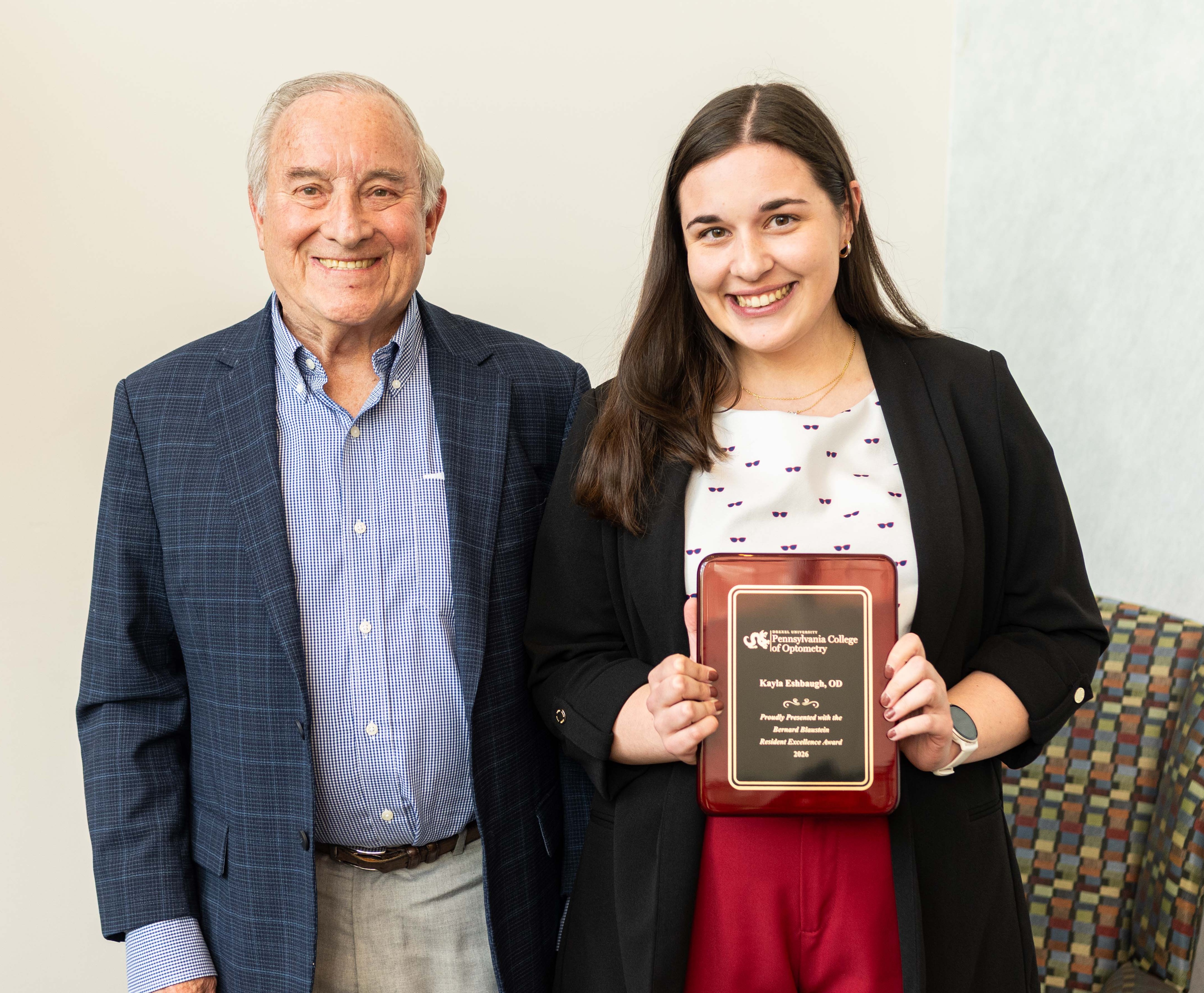 Dr. Bernie Blaustein and Dr. Kayla Eshbaugh with award