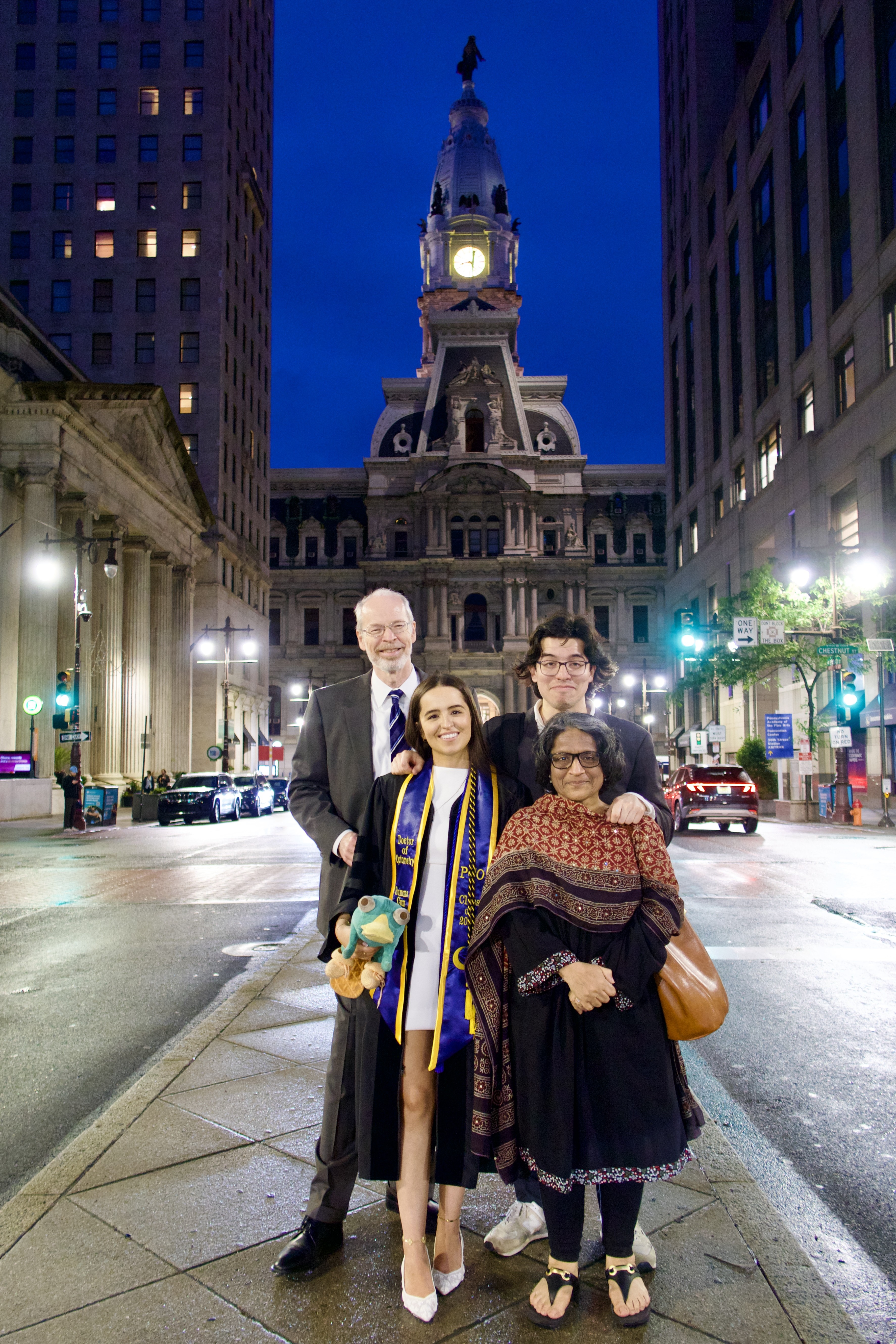 Shirin Ludwig and family commencement pic in front of City Hall
