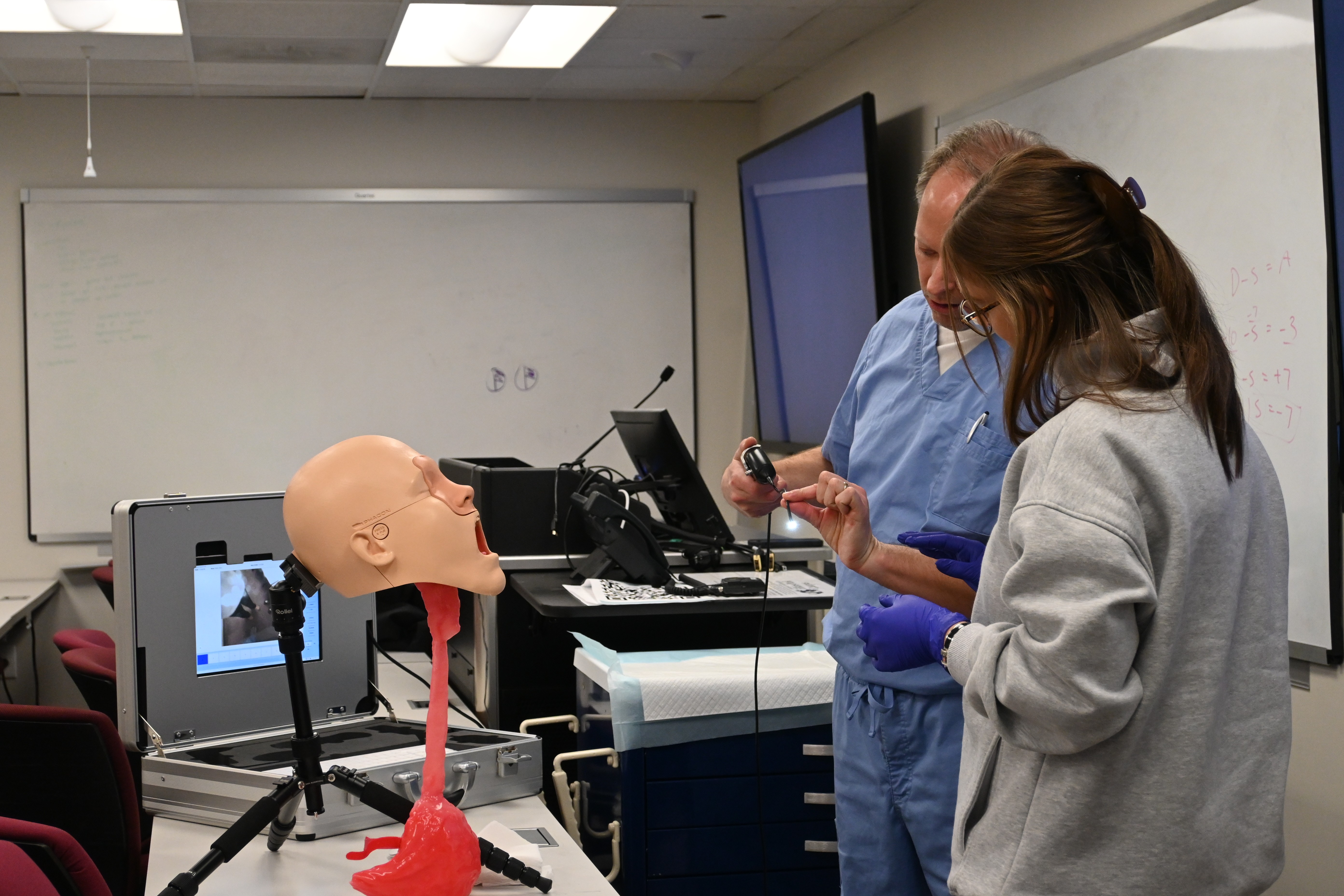 SLP faculty member with student in the lab pic2