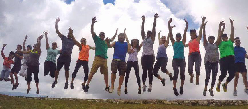 group photo of students jumping in the air