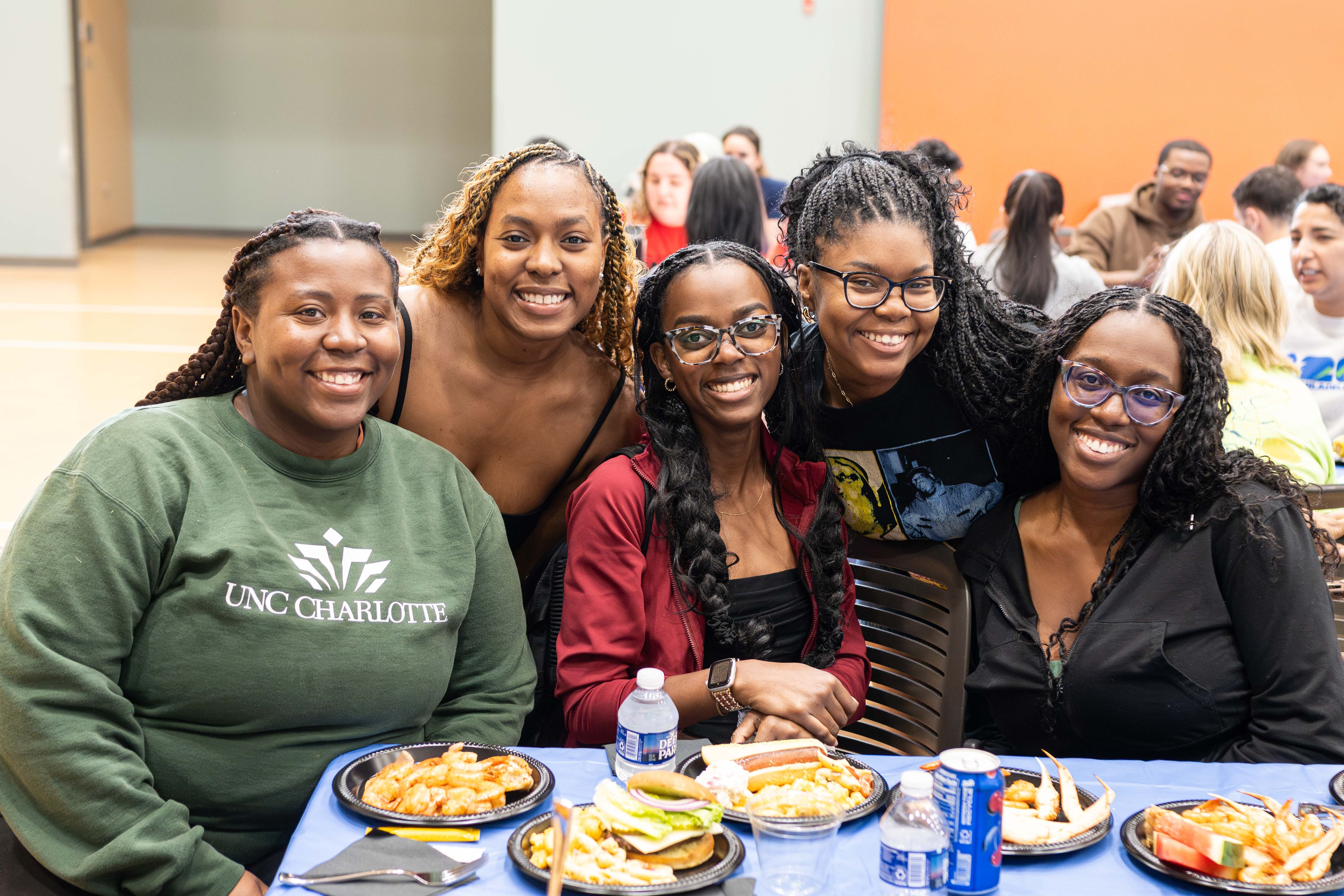 Six students get ready for the food line at summer barbecue