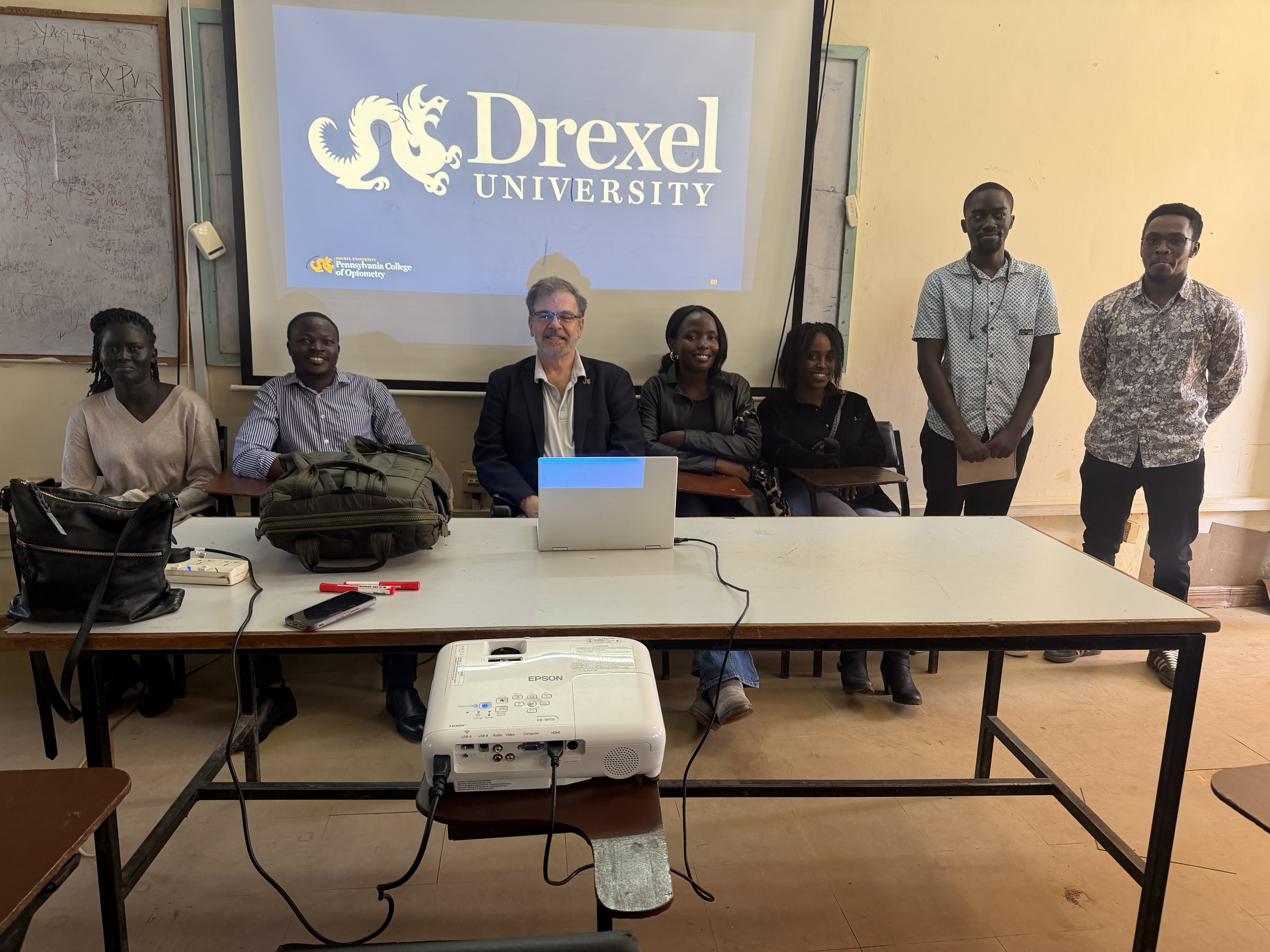Dr. Jeffrey Weaver with Kenya delegation at table