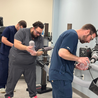 O&P students trimming prosthetic devices in the lab