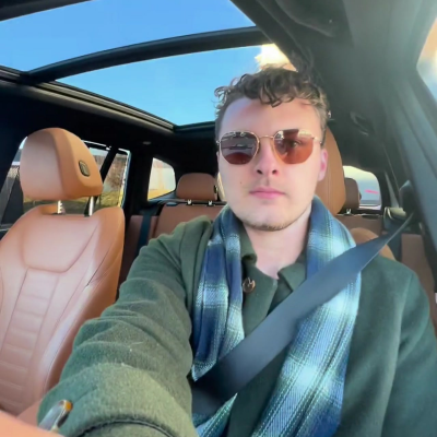 Alex taking selfie in his car