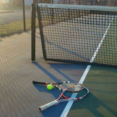 tennis court net and rackets