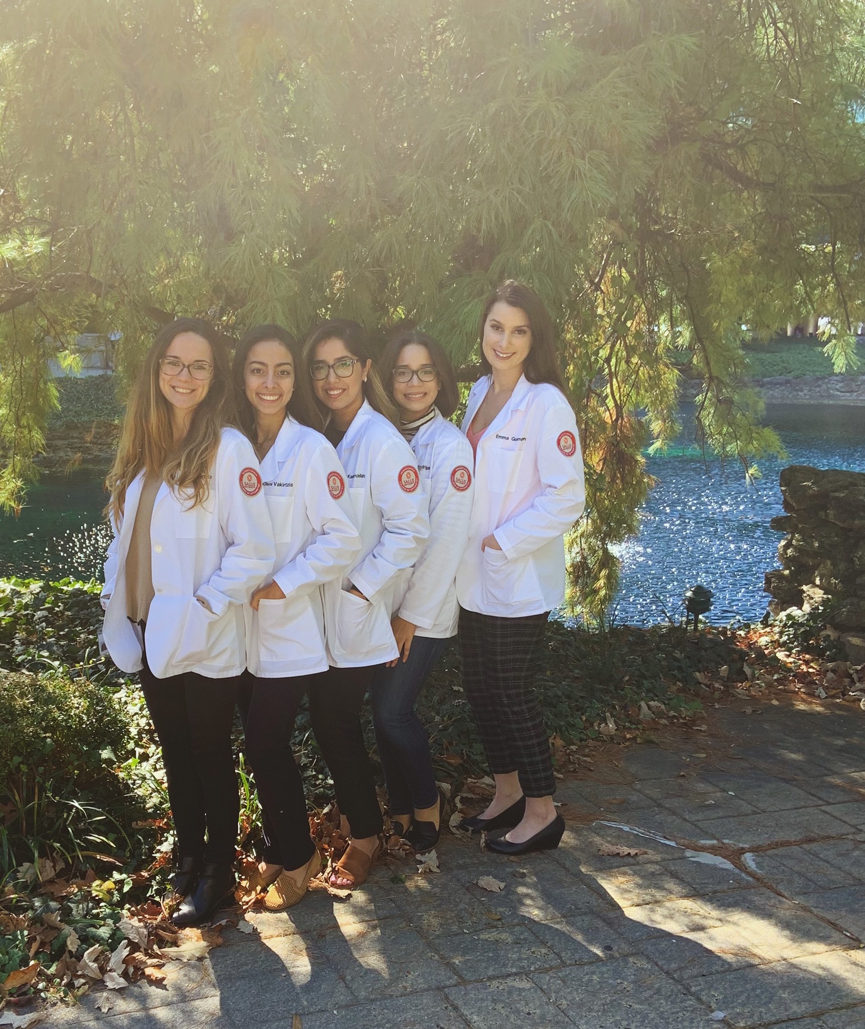 Emma and fellow Optometry students in their white coats
