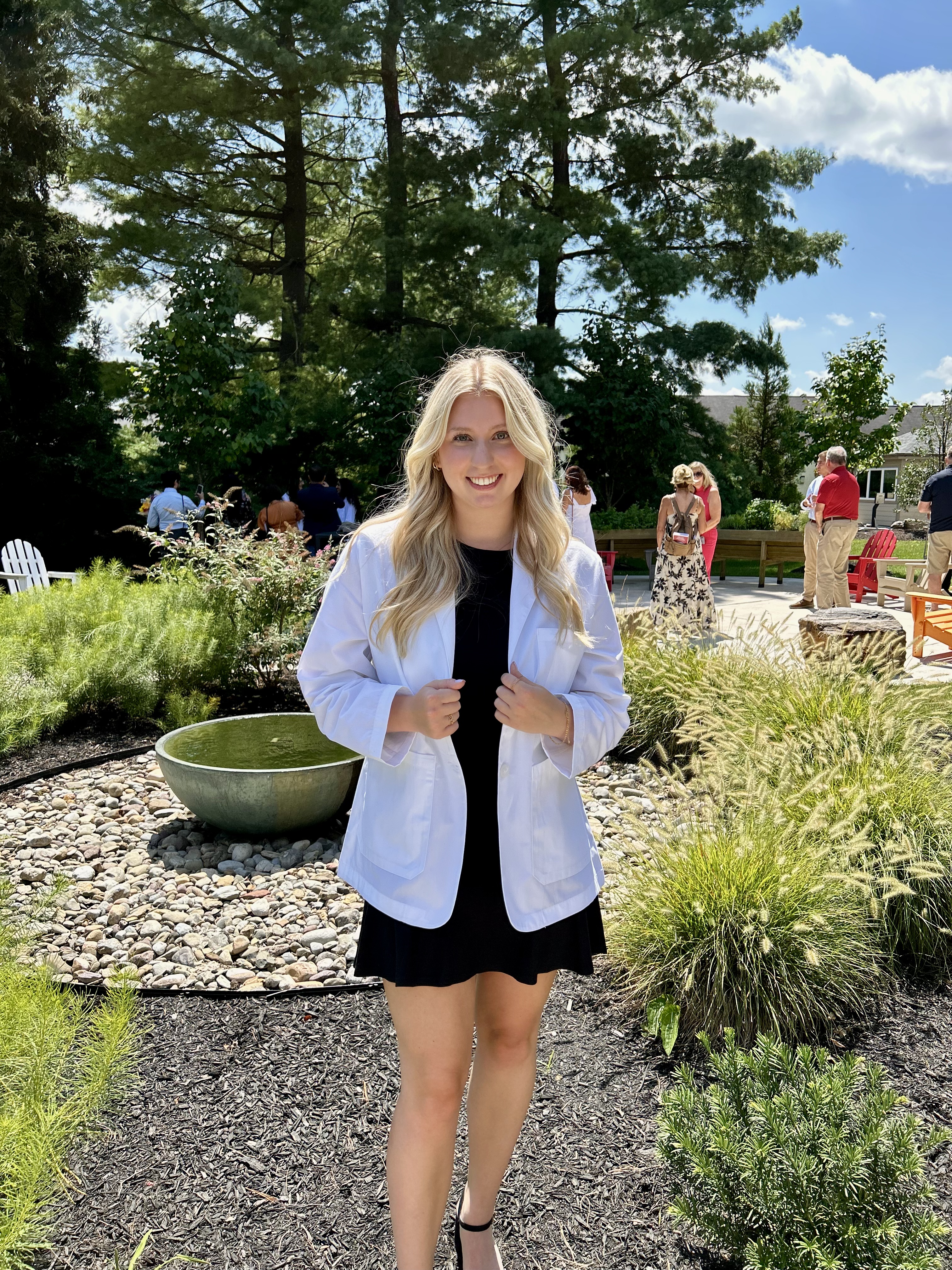 Kacie in her white coat