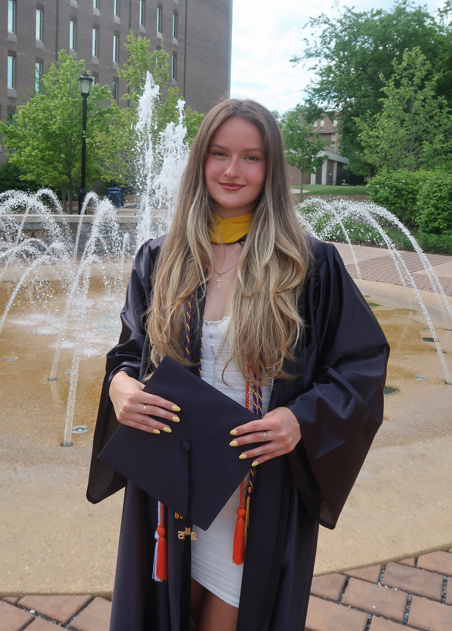 Masha wearing her graduation gown