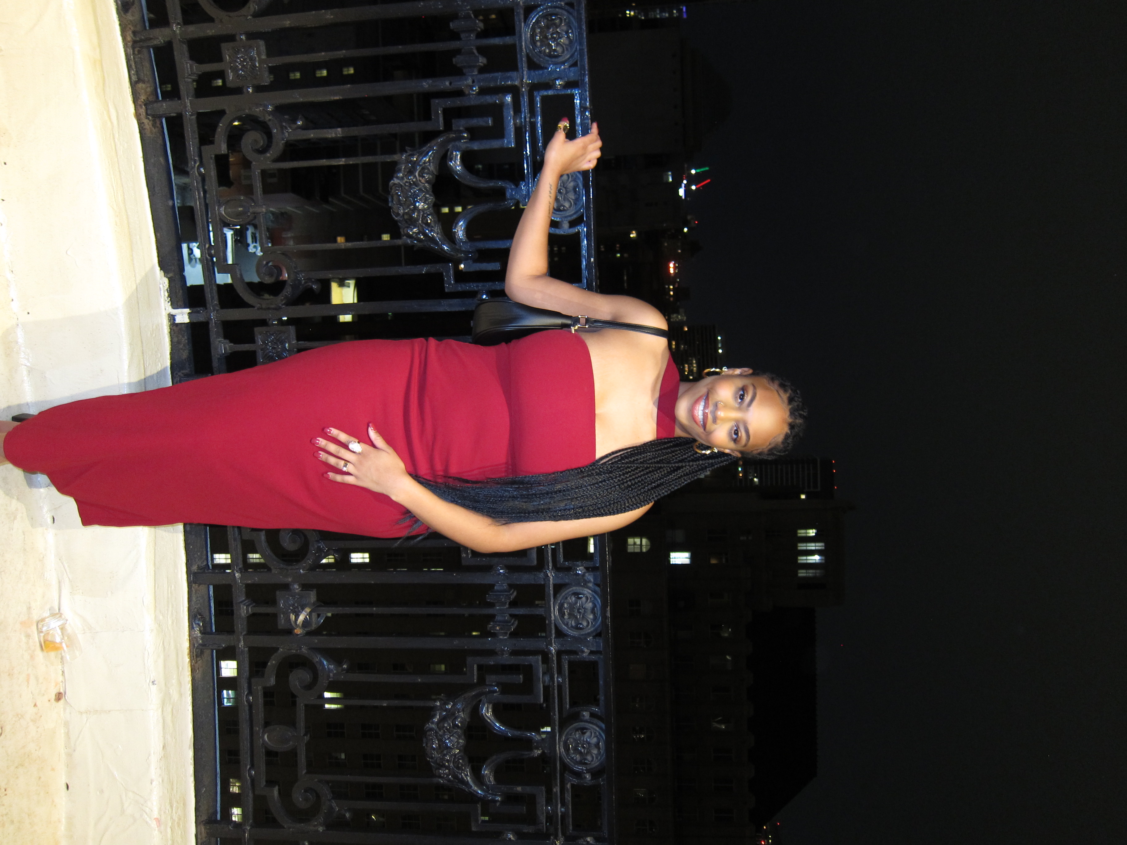 Cydney standing in front of cityscape