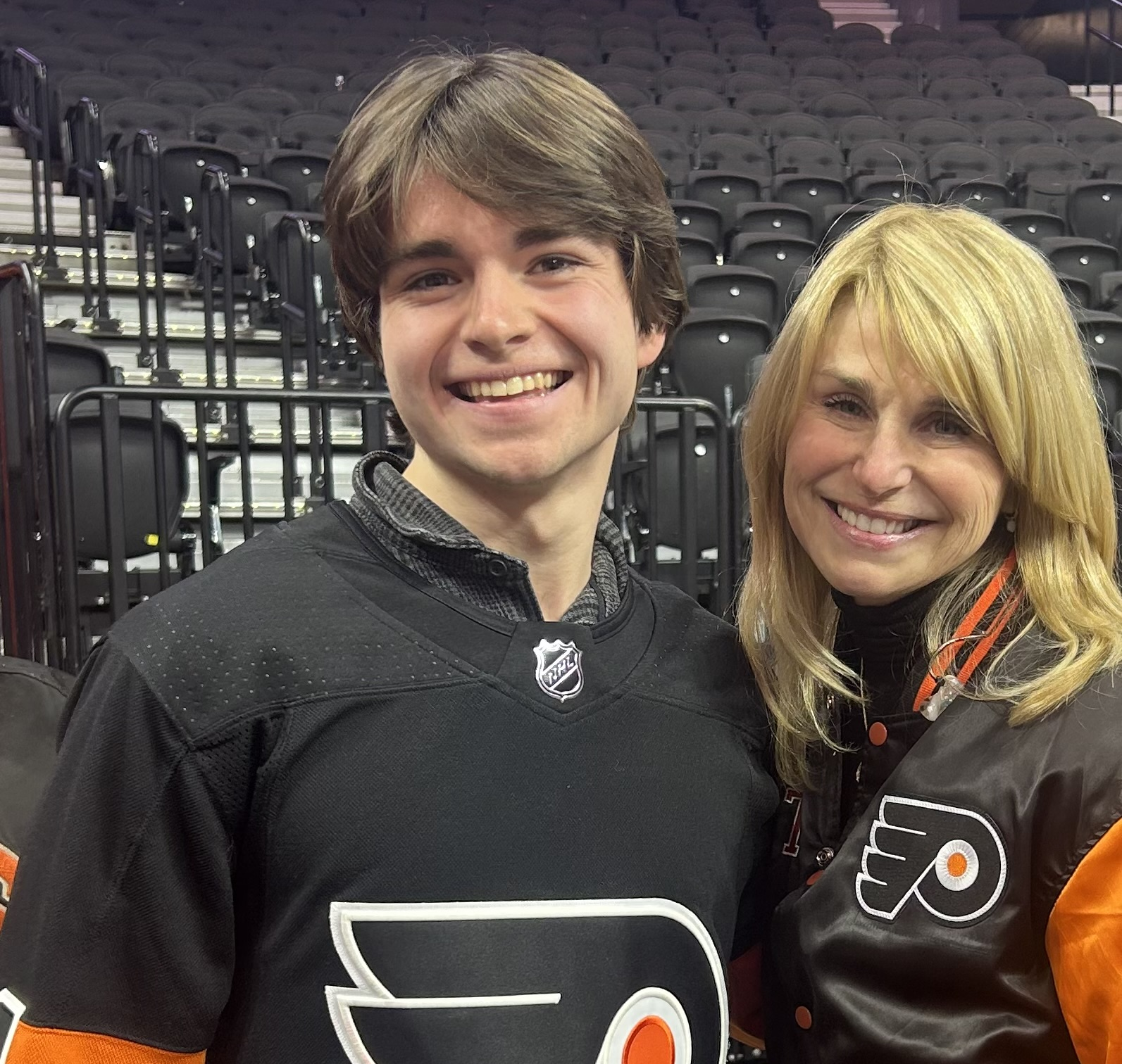 Tyler and friend wearing Philadelphia Flyers jerseys