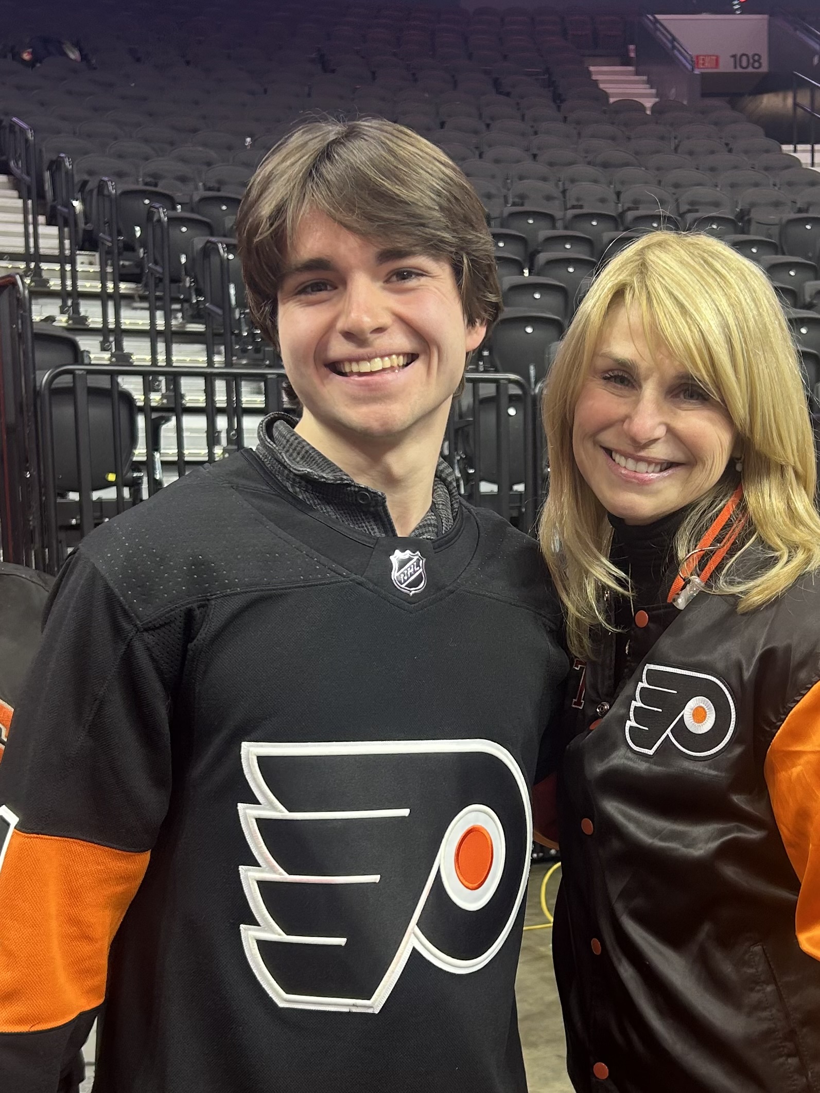 Tyler and friend wearing Philadelphia Flyers jerseys