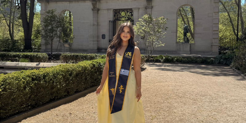 Joanna wearing her commencement sash