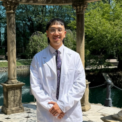 Ken wearing his white coat